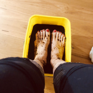 Feet in a footbath of humic acid
